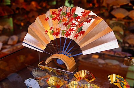 Japan,Honshu Island,Kyoto. A shop window display of traditional Japanese fans. Japanese fans evolved into an art form during the Edo period,1690-1868. Hand-made and hand-painted Japanese folding fans known as maiougi are the kind used in Japanese traditional dance. Simple Japanese paper fans are sometimes known as harisens. Stock Photo - Rights-Managed, Code: 862-03712582