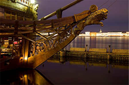 simsearch:862-07690164,k - Russia, St.Petersburg; The mast of a ship depicting a lion floating on the Neva River with Imperial palaces in the background. Stock Photo - Rights-Managed, Code: 862-03713217