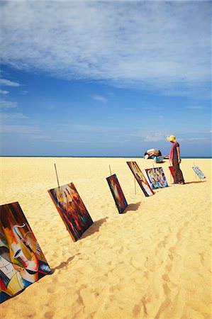 Woman looking at paintings on beach, Negombo, Sri Lank. Stock Photo - Rights-Managed, Code: 862-03713585