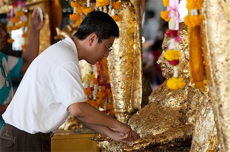 Bangkok, Thailand. Praying at a buddhist temple Stock Photo - Rights-Managed, Code: 862-03713799