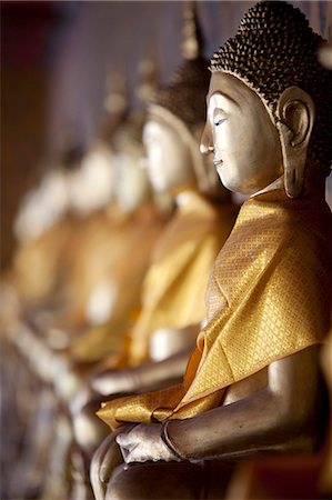 Statues of Buddha in the Wa Arun Temple in Bangkok Thailand Stock Photo - Rights-Managed, Code: 862-03713818