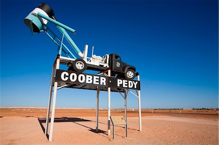 Australia, South Australia, Coober Pedy. A blower (truck used to extract dirt from opal mines) welcomes visitors to the town. Stock Photo - Rights-Managed, Code: 862-03736249
