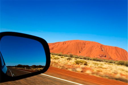 Australia, Northern Territory, Uluru-Kata Tjuta National Park. View out the car window driving toward Uluru (Ayers Rock). (PR) Stock Photo - Rights-Managed, Code: 862-03736283