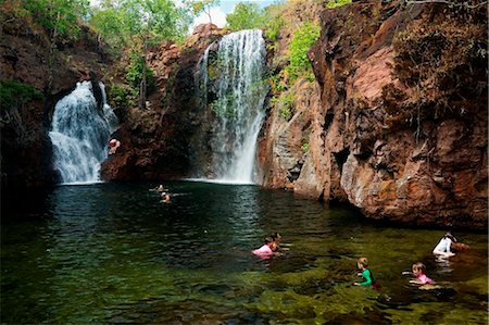 person jumping lake not dock - Australia, Northern Territory, Litchfield National Park.  Swimmers at Florence Falls.(PR) Stock Photo - Rights-Managed, Code: 862-03736326