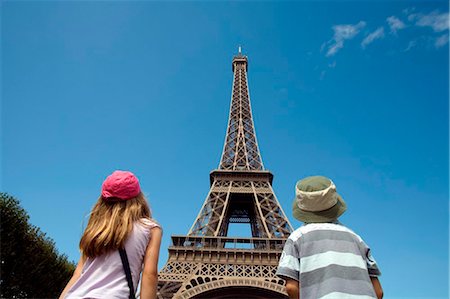 dwarf - Paris, France. A boy and girl looking up at the Eiffel Tower. Stock Photo - Rights-Managed, Code: 862-03736711