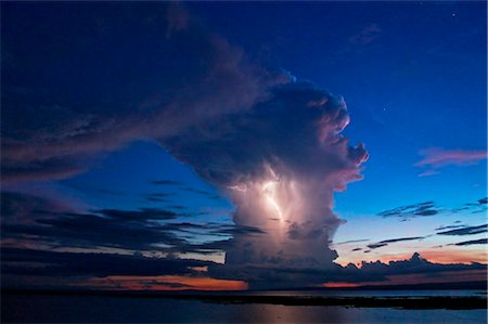 Kenya, Nyanza District. A violent evening storm with forked lightning over Lake Victoria . Stock Photo - Rights-Managed, Code: 862-03736813