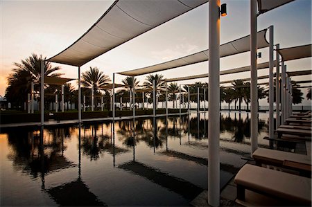 simsearch:862-07690507,k - Oman, Mascate, Mascate, Ghubrah. La piscine principale dans la localité de Chedi Hotel de luxe 5 étoile au coucher du soleil. Photographie de stock - Rights-Managed, Code: 862-03737048