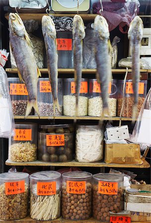 Dried fish hanging up at dried seafood stall, Des Voeux Road West, Sheung Wan, Hong Kong, China Stock Photo - Rights-Managed, Code: 862-03731085
