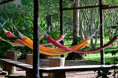 Peru. Colourful hammocks at  Inkaterra Reserva Amazonica Lodge, situated on the banks of the Madre de Dios River. Stock Photo - Rights-Managed, Code: 862-03732020