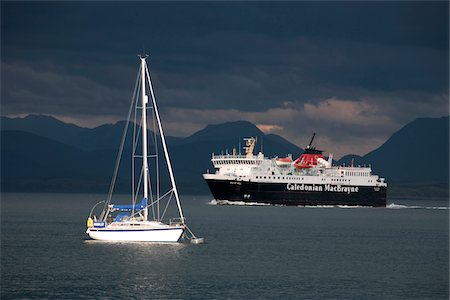 simsearch:862-03361556,k - Scotland, Isle of Mull. A ferry passing a moored yacht in the Sound of Mull enroute to Tobermory on the Isle of Mull. Stock Photo - Rights-Managed, Code: 862-03732287