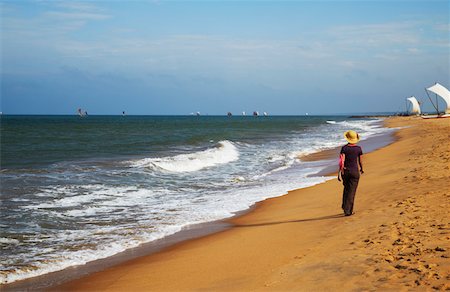 simsearch:400-05745636,k - Woman walking on beach, Negombo, Sri Lank. Stock Photo - Rights-Managed, Code: 862-03732407