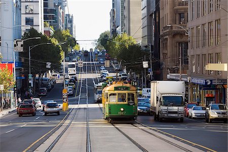 simsearch:862-06541761,k - Australia, Victoria, Melbourne.  A tram trundles along the streets of downtown Melbourne. Stock Photo - Rights-Managed, Code: 862-03807260