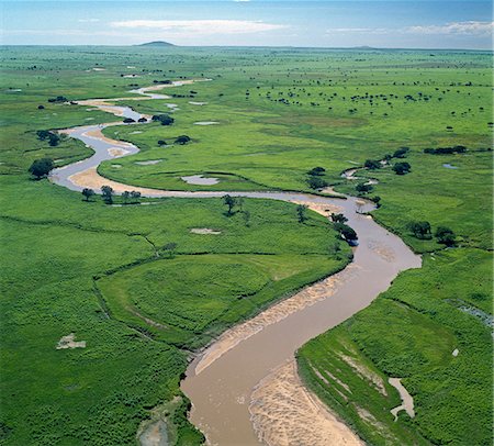 The Garamba River winds it way through the grasslands of the Garamba National Park in Northern Congo DRC. Stock Photo - Rights-Managed, Code: 862-03807345