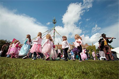 Norfolk, Holt Hall. Children dressed as fairies dance around a maypole at the annual Fairy Fair. Stock Photo - Rights-Managed, Code: 862-03807358