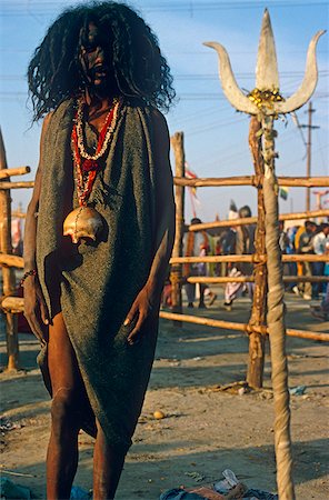 sadhu - India, Uttar Pradesh, Allahabad. A sadhu (or Hindu ascetic) from the extreme Aghori sect with a skull begging bowl around his neck at the Kumbh Mela festival which is held here every twelve years. Stock Photo - Rights-Managed, Code: 862-03807577