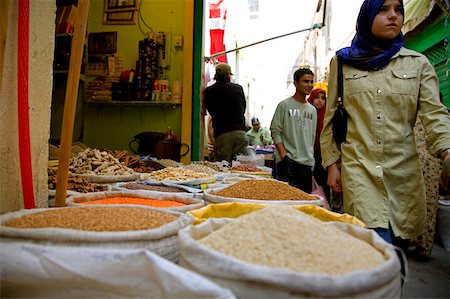 Tripoli, Libya; A Muslim girl passing beside different shops at the 'souk' of the old Medina Stock Photo - Rights-Managed, Code: 862-03807845