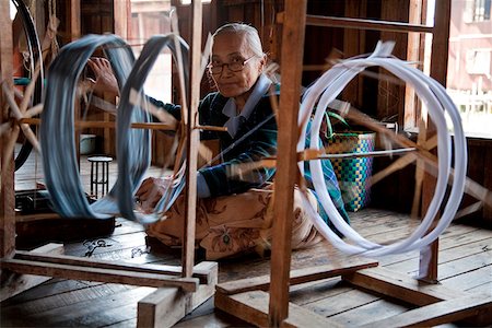 Myanmar, Burma, Inle Lake.  Spinning silk in a weaving factory, Inle Lake. Stock Photo - Rights-Managed, Code: 862-03807991