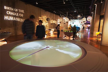 People looking at displays inside Maropeng Visitors Centre, Cradle of Humankind, (UNESCO World Heritage Site), Gauteng, South Africa Stock Photo - Rights-Managed, Code: 862-03808260