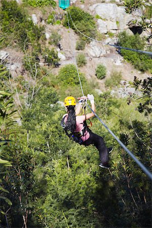 Woman sliding down a zip-line, Storms River, Eastern Cape, South Africa Stock Photo - Rights-Managed, Code: 862-03808540