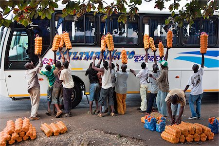 simsearch:862-06543210,k - Orange-sellers offer their fruit to passengers on a coach travelling from Dar-es-Salaam to Nairobi. Stock Photo - Rights-Managed, Code: 862-03808666