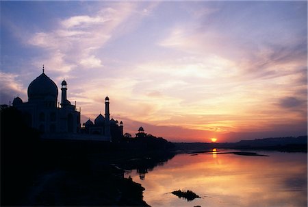 The Taj Mahal from across the Yamuna River, Agra.The Taj Mahal was built by a Muslim, Emperor Shah Jahan in the memory of his dear wife and queen Mumtaz Mahal.It is an elegy in marble or some say an expression of a dream. Stock Photo - Rights-Managed, Code: 862-03820604