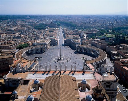 View from the dome of St Peters, Rome, Italy. Built to a plan initially conceived at the turn of the fifteenth century by Donato Bramante  and finished off, heavily modified, over a century later by Carlo Maderno. Stock Photo - Rights-Managed, Code: 862-03820636