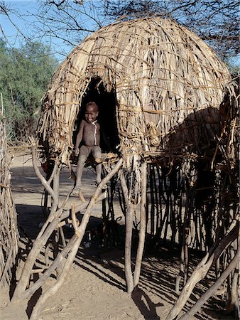 simsearch:862-03366124,k - The Turkana families living near the seasonal Kerio River build their houses on stilts. This innovative style is found nowhere else in Turkanaland but suits the conditions at Lokori where the friable soil becomes a quagmire in heavy rain. Stock Photo - Rights-Managed, Code: 862-03820660
