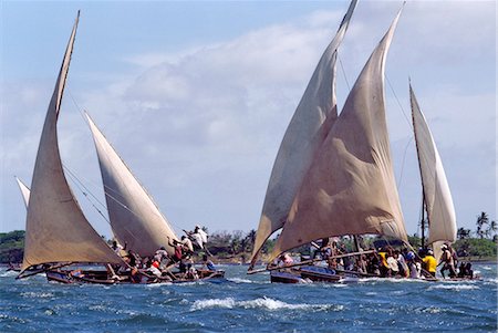 As a part of Maulidi, Lamu Islands celebrations to mark the birthday of the Prophet Mohamed, a keenly fought boat race is held. Maulidi is a joyous event in Lamu and attracts pilgrims from all over East Africa and sometimes farther afield. Stock Photo - Rights-Managed, Code: 862-03820725