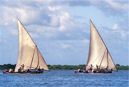 As a part of Maulidi, Lamu Islands celebrations to mark the birthday of the Prophet Mohamed, a keenly fought boat race is held. Maulidi is a joyous event in Lamu and attracts pilgrims from all over East Africa and sometimes farther afield. Stock Photo - Rights-Managed, Code: 862-03820727