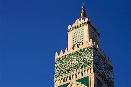 The Hassan II Mosque in Casablanca is the third largest in the world after those at Mecca and Medina, and its minaret, at 210m, is the tallest of all.It was built to commemorate former king Hassan IIs 60th birthday in 1993. Stock Photo - Rights-Managed, Code: 862-03820874