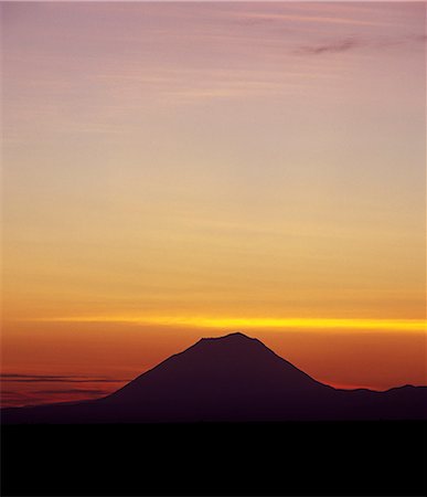 simsearch:862-03355195,k - Sunrise over Ol Doinyo Lengai, The Maasais Mountain of God, which is the only active volcano in the Gregory Rift.An important section of the eastern branch of Africas Great Rift Valley. Stock Photo - Rights-Managed, Code: 862-03821008