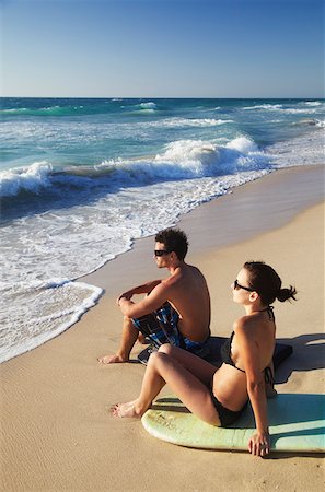 Jeune couple assis sur des planches de surf horizontal, Brighton beach, Perth, Australie-occidentale, Australie Photographie de stock - Rights-Managed, Code: 862-03887247