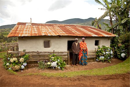 equator - Burundi. A couple outside a traditional house on their farm. Stock Photo - Rights-Managed, Code: 862-03887453