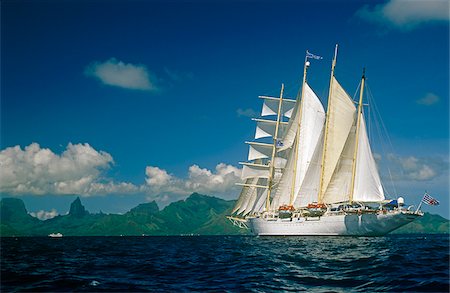 sailboat  ocean - French Polynesia, Society Islands, Leeward Islands, Moorea, aka Aimeho. Star Flyer, a four-masted barquentine and part of the Star Clippers cruise line, sails off the coast of Moorea. Stock Photo - Rights-Managed, Code: 862-03887687