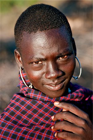 simsearch:862-03888708,k - A young Pokot warrior with large round earrings. The Pokot are pastoralists speaking a Southern Nilotic language. Stock Photo - Rights-Managed, Code: 862-03888703