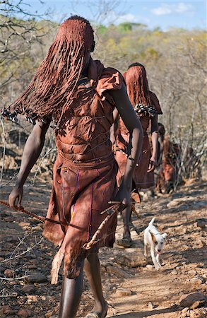 simsearch:862-03888708,k - After 2-3 months seclusion, Pokot initiates leave their camp in single file to celebrate Ngetunogh.  They must wear goatskins, conceal their faces with masks made from wild sisal (sansevieria) and carry bows with blunt arrows until this ceremony is over. Stock Photo - Rights-Managed, Code: 862-03888756
