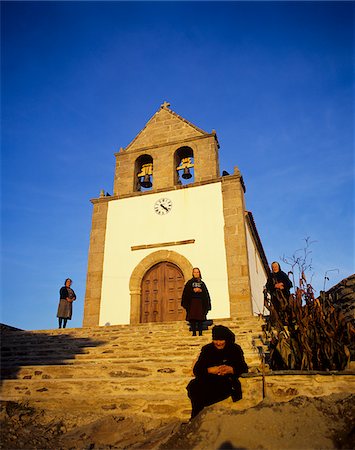 Old women near the ancient church of Gimonde at sunset, Tras os Montes, Portugal Stock Photo - Rights-Managed, Code: 862-03889025