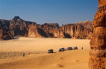 saudi arabia people - Saudi Arabia, Madinah, Al-Ula. Tourists enjoy 4WD excursions in the spectacular wadis and rugged hills that comprise the desert on the edge of Al-Ula. Stock Photo - Rights-Managed, Code: 862-03889526