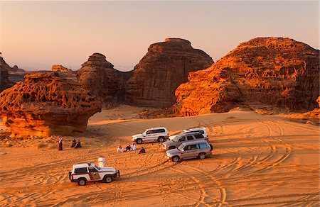 saudi arabia people - Saudi Arabia, Madinah, Al-Ula. Tourists enjoy 4WD excursions in the spectacular wadis and rugged hills that comprise the desert on the edge of Al-Ula. Stock Photo - Rights-Managed, Code: 862-03889529