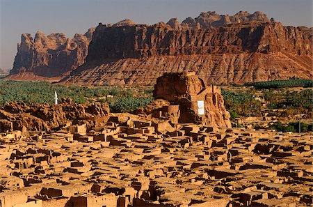 Saudi Arabia, Madinah, Al-Ula. The small yet striking castle of Musa Abdul Nasser rises in the midst of the crumbling mud-brick houses of Old Al-Ula, an oasis occupying the site of an ancient city called Dedan. Stock Photo - Rights-Managed, Code: 862-03889521