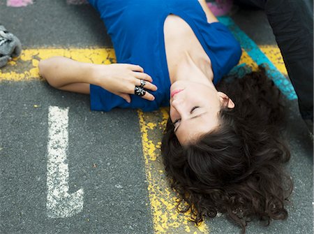 simsearch:877-06833898,k - Teenage girl lying on the floor Stock Photo - Rights-Managed, Code: 877-06834002