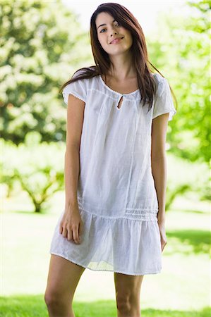 simsearch:877-06832290,k - Young woman with white dress in green scenery Stock Photo - Rights-Managed, Code: 877-06834135