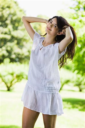 simsearch:877-06832318,k - Young woman with white dress in green scenery Stock Photo - Rights-Managed, Code: 877-06834136