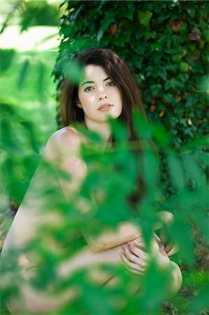 simsearch:877-06834306,k - Young naked woman squatting next to tree Stock Photo - Rights-Managed, Code: 877-06834139