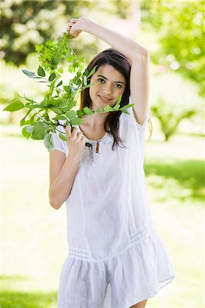 simsearch:877-06832290,k - Young woman holding leaves Stock Photo - Rights-Managed, Code: 877-06834130