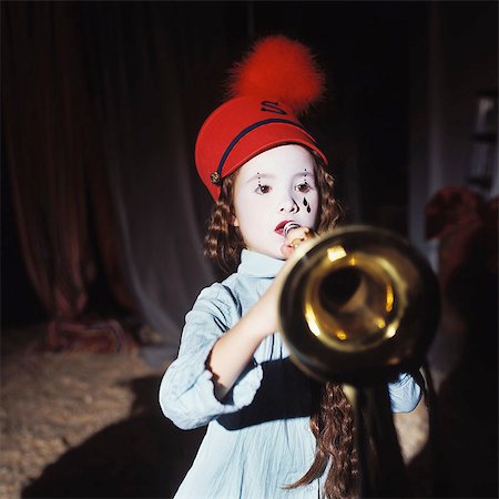 Little girl playing music in the circus Stock Photo - Rights-Managed, Code: 877-06834941