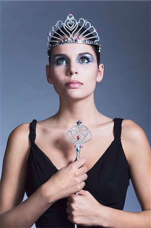 Young woman holding fairy wand, tiara, black dress Stock Photo - Rights-Managed, Code: 877-06836198