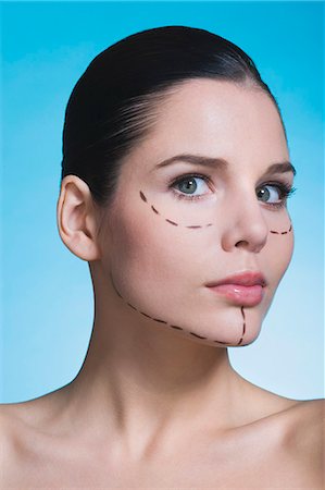 Young woman with presurgical markings on face Stock Photo - Rights-Managed, Code: 877-06836291