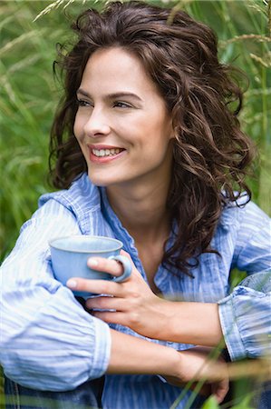 simsearch:877-06832318,k - Portrait of young woman holding cup Stock Photo - Rights-Managed, Code: 877-06836414
