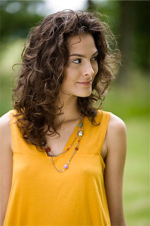 simsearch:877-06832318,k - Portrait of a young woman looking away Stock Photo - Rights-Managed, Code: 877-06832197